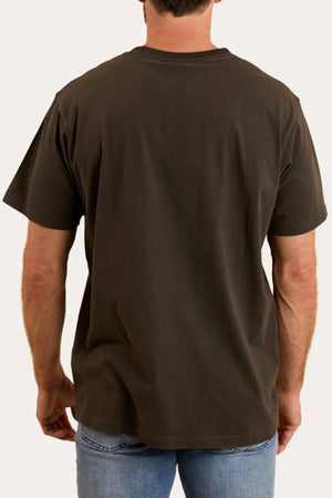 A man stands with his back to the camera, wearing the Ringers Western Princeton Loose Fit T-Shirt made from 100% cotton jersey and light blue jeans against a plain background.