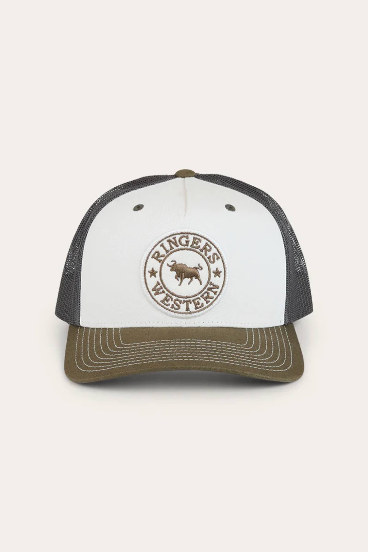 The Ringers Western Signature Bull Trucker Cap features a white front, olive green brim, black mesh back, and a circular "Ringers Western" patch with a bold bull logo at the center.