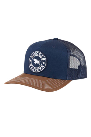 The Ringers Western Signature Bull Trucker Cap features a navy blue and brown design with a mesh back, round bull patch on the front, white-stitched brown brim, and an adjustable strap for comfort.