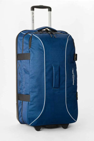 The Rip Curl F-Light Global Search Ref 100L Travel Bag stands upright on wheels, featuring a blue design with black accents, retractable handle, side straps, and white piping—ideal for long trips and built for durability.