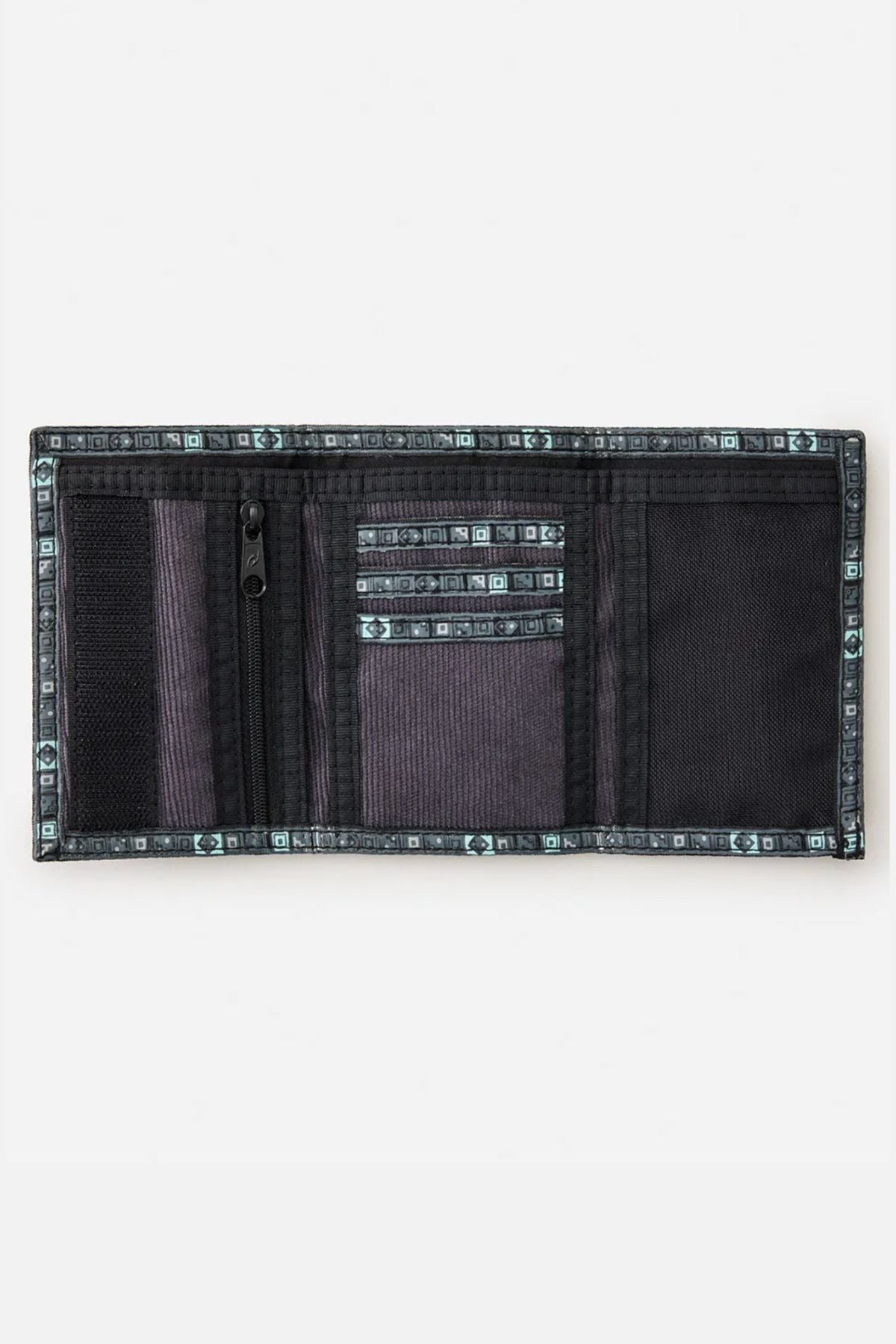 The Rip Curl Archive Cord Surf Wallet in black and grey is open, revealing card slots, a zippered coin pocket, mesh compartments, and a tri-fold design with patterned trim along the edges.