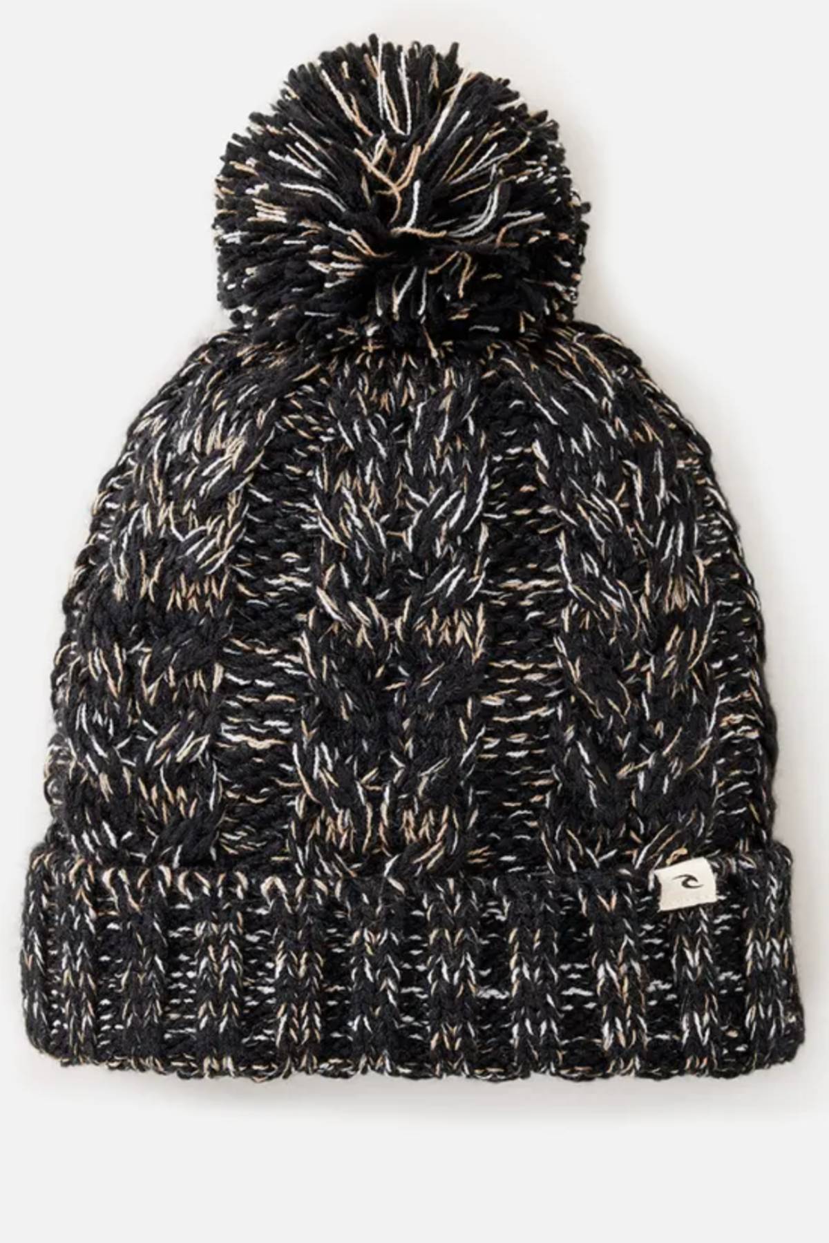 The Rip Curl Classic Regular Pom Pom Beanie is a black and white cable knit hat with a large top pom-pom, a folded brim, and a small rectangular front tag.