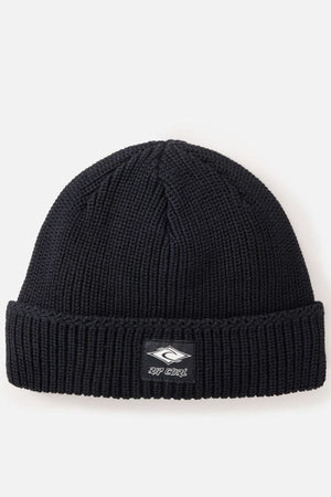 The Rip Curl Classic Surf Lined Reg Beanie is a black ribbed knit hat with a folded brim and a small logo patch on the front—ideal for Rip Curl fans and outdoor adventures.