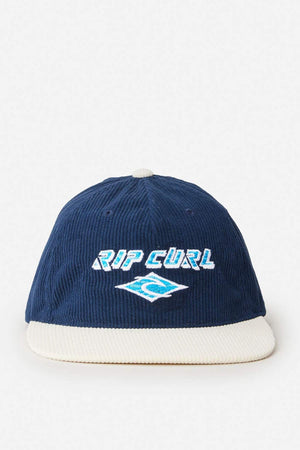 The Rip Curl Diamond Adj Cap is a blue 11 Wale Cord cap with a white brim, embroidered logo, and "RIP CURL" wave design on the front.