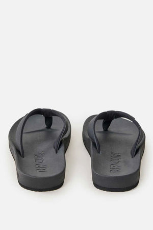 A pair of Rip Curl Essential Contour Bloom Thongs in black, featuring a contoured footbed and shown from the back on a plain light gray background.