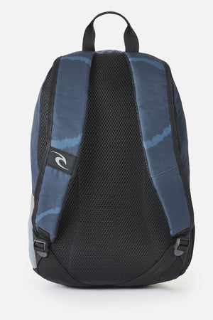 Rip Curl Evo 24L Rinsed Backpack in blue and dark grey, showing the back panel with black mesh padding and adjustable shoulder straps.