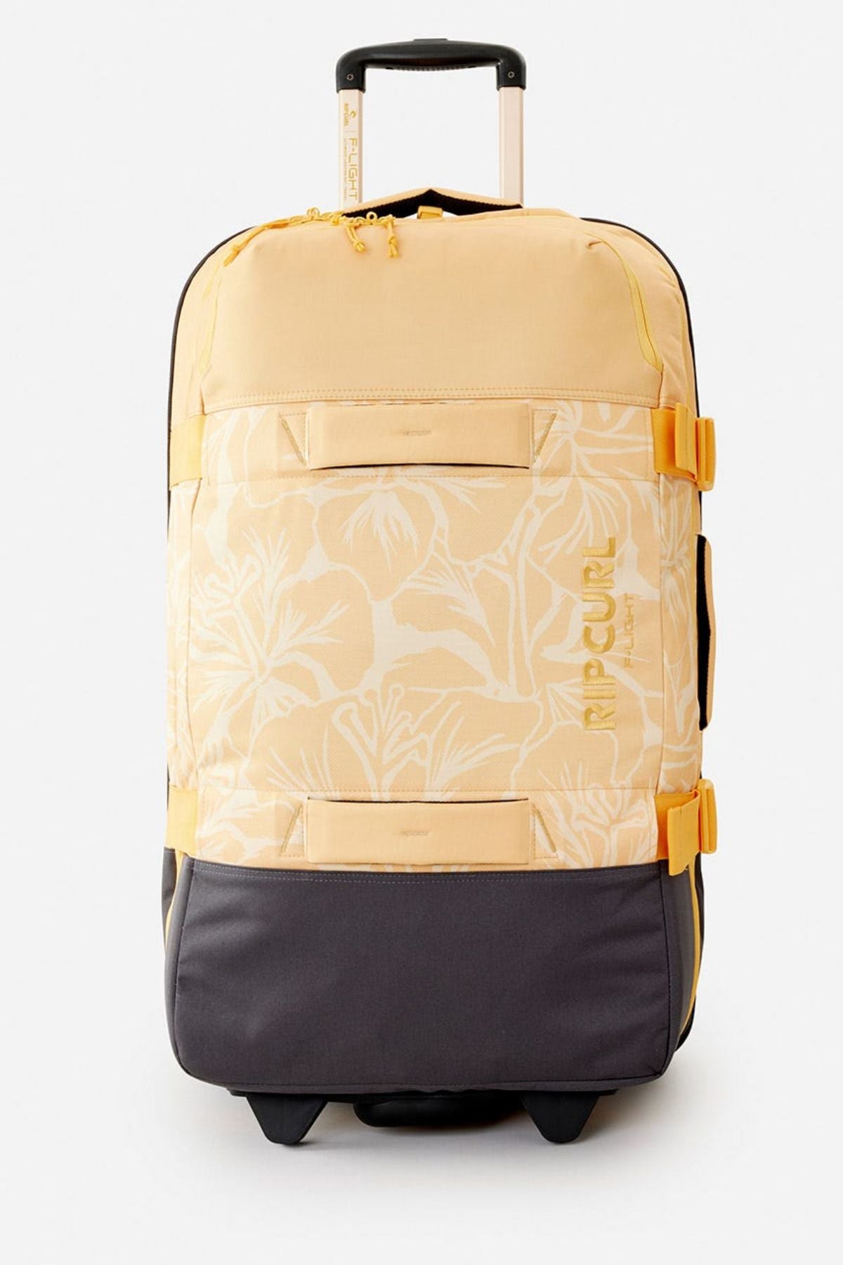 The Rip Curl F-Light Global 100L Tropics Travel Bag features a yellow and gray tropical floral design, front pockets, lockable zips, an extended black and gold handle, and "Rip Curl" printed on the side.