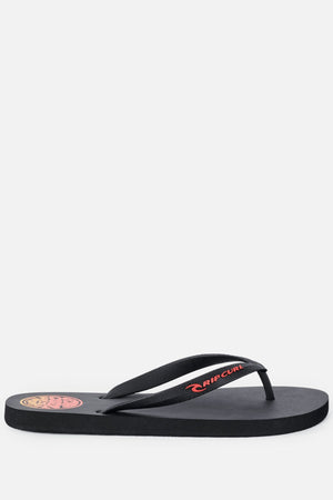 The Rip Curl Icons Of Surf Bloom Open Toe Sandal is a black sandal with an open toe, featuring a red and yellow “Rip Curl” logo on the strap and a circular logo on the heel. Crafted with BLOOM algae foam for enhanced comfort, it is displayed against a plain white background.