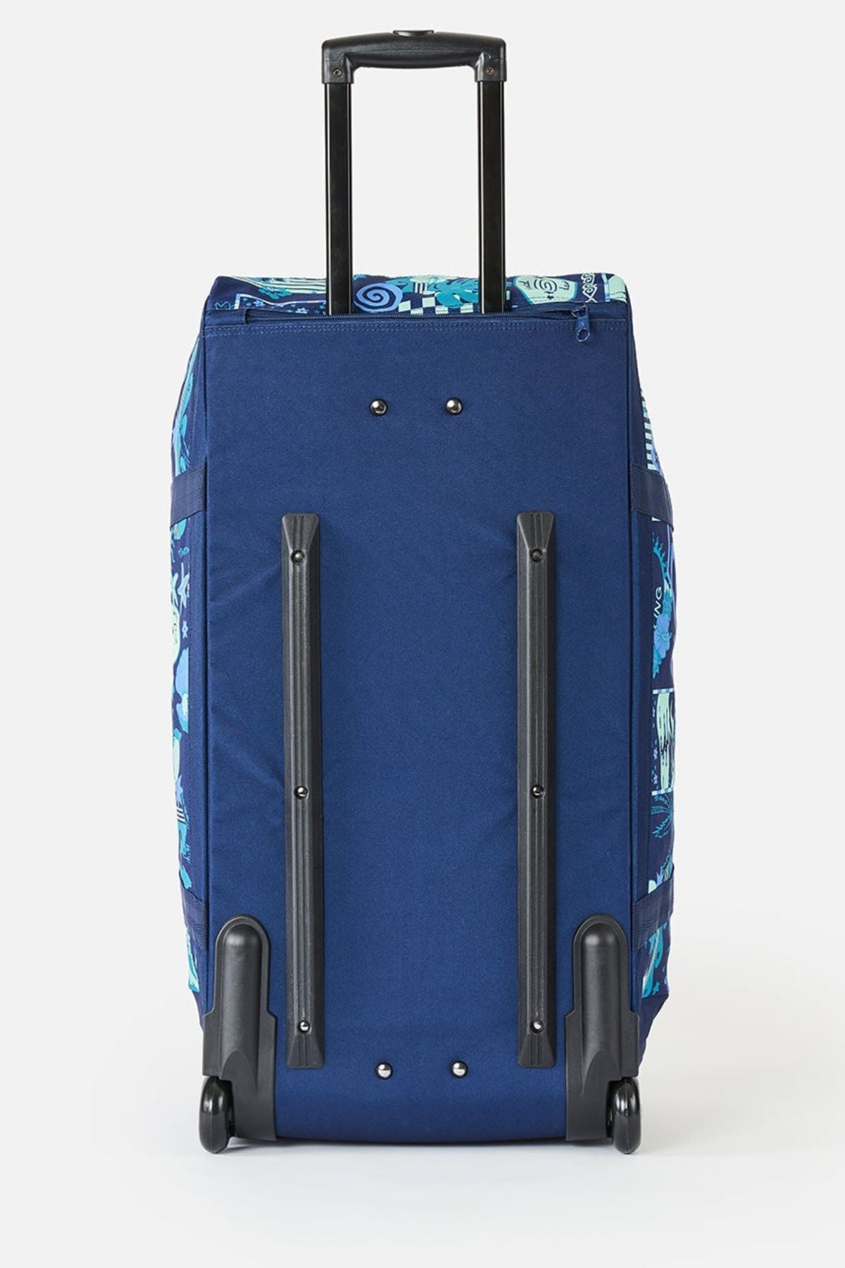The Rip Curl Jupiter 80L Mixed Travel Bag stands upright with an extended black handle, black plastic rails, and two wheels. It has patterned blue accents on the sides and top, and is made from recycled polyester.