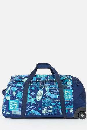 The Rip Curl Jupiter 80L Mixed Travel Bag is a blue, spacious travel bag with two handles, made from recycled polyester and decorated with a tropical pattern of palm trees and sea creatures—ideal for stylish, eco-friendly adventures.