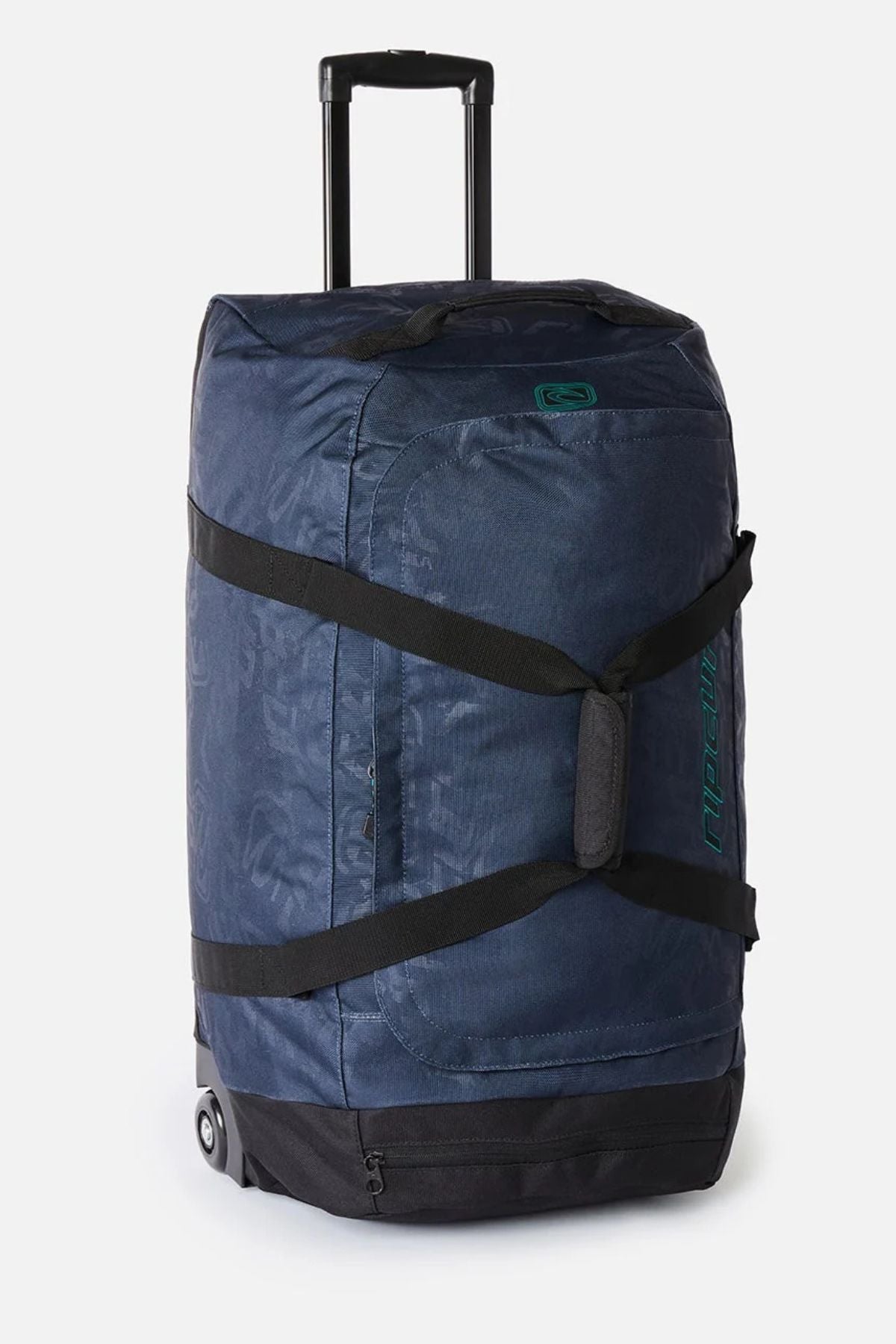 Dark blue patterned Rip Curl Jupiter Archive 80L rolling duffel bag with black straps, a telescoping handle, and wheels.
