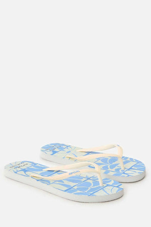 A pair of Rip Curl Mixed Bloom Thongs in light blue with white and cream straps, a geometric footbed pattern, and a comfy 3-point design, shown on a plain white background.