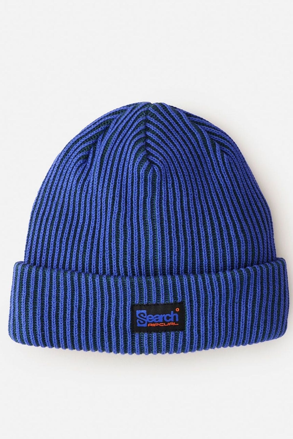 The Rip Curl Search Chunky Reg Beanie is a blue ribbed knit, 100% cotton beanie with a folded brim and a rectangular "Search" patch on the front—an essential cold weather accessory.