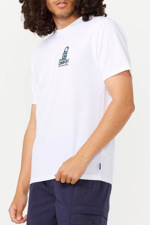 A person with curly hair is wearing a Rip Curl Vaporcool Search Stack Tee, praised for its quick-drying fabric, paired with dark blue cargo shorts against a plain light-colored background.