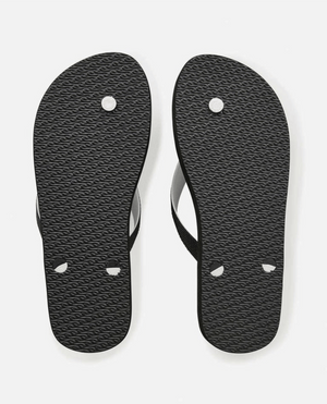 Black Rip Curl Breakers Bloom Thongs crafted from BLOOM algae-blended foam showcasing a textured sole and visible thong attachment points against a crisp white background, as part of Rip Curl's eco-friendly fashion collection.