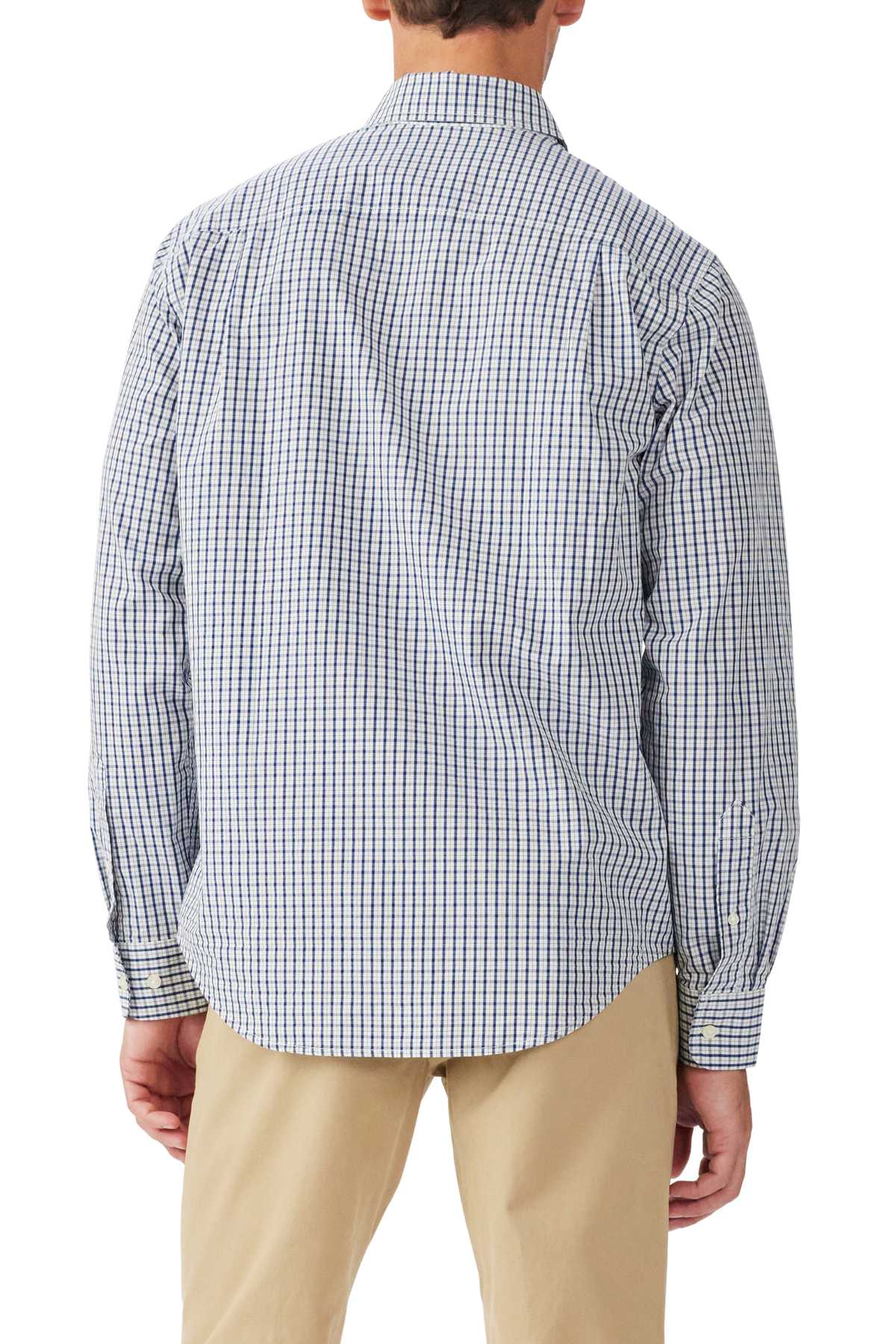 A person is shown from the back wearing an untucked RM Williams Augusta Classic Poplin Shirt in blue and white check with Longhorn embroidery, paired with beige pants. The long-sleeve button-up adds a relaxed yet refined touch as their arms rest at their sides.