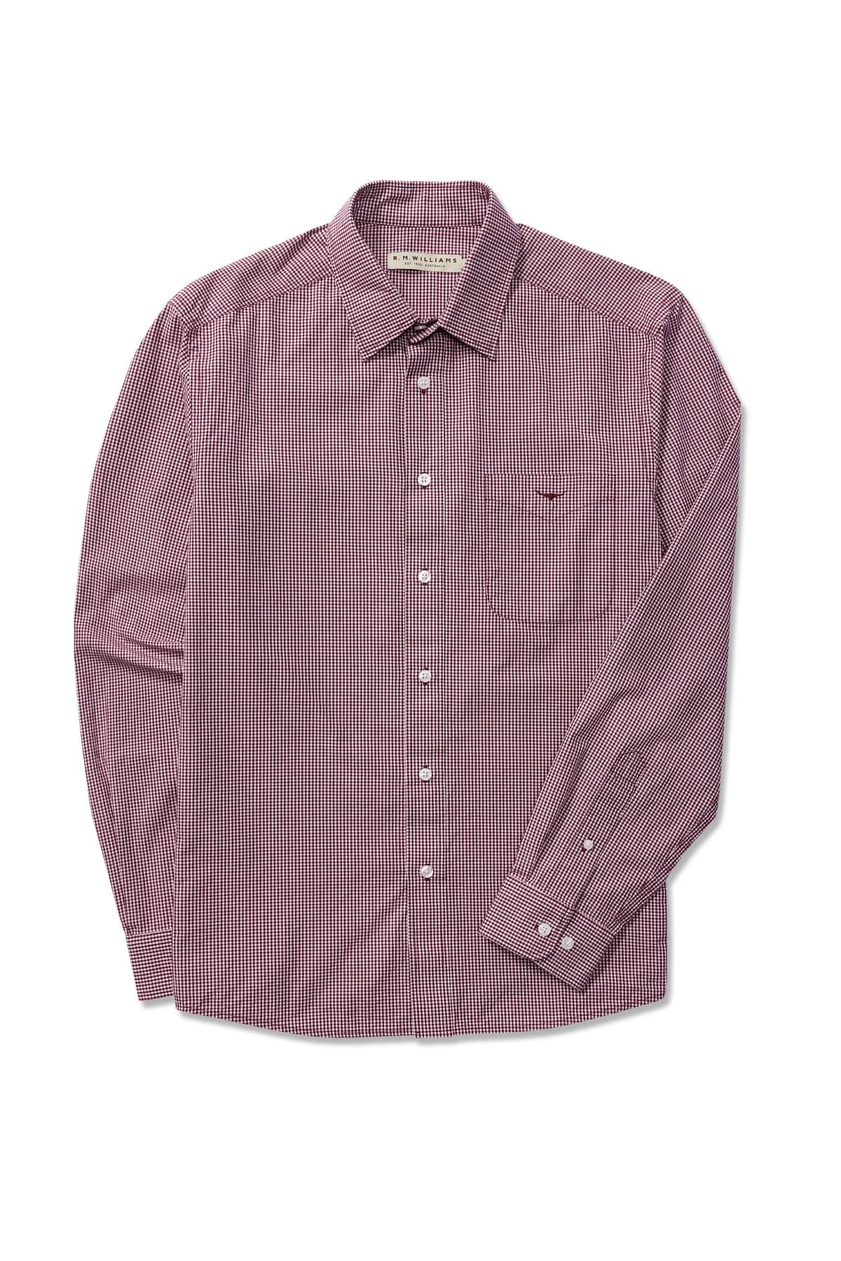 The RM Williams Classic Shirt, made from organic cotton, features a red and white micro gingham check pattern, long sleeves, a front chest pocket, and white buttons. It is displayed laid flat on a white background.