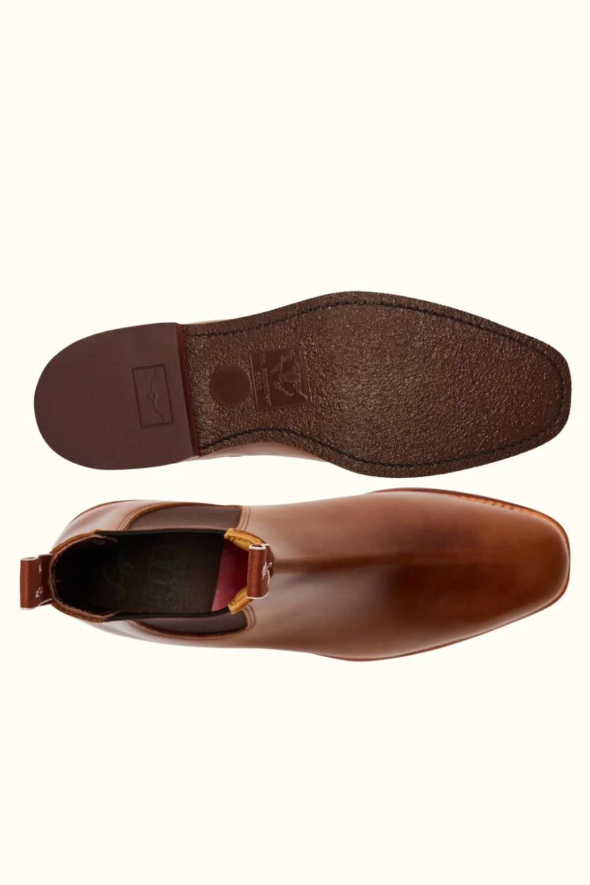 The RM Williams Comfort Craftsman Boot, in brown pull-up leather, is displayed from above and below to showcase its smooth upper and textured rubber sole against a plain light background.