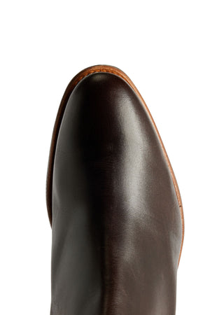 Close-up of the toe area of the RM Williams Comfort Lady Yearling Rubber Sole Boot, featuring polished brown leather and a light brown sole, made in Australia, photographed against a white background.