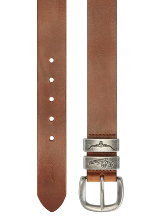 The RM Williams Drover Belt is crafted from premium brown leather with a smooth finish and pointed tip, featuring an antique silver engraved buckle and five adjustment holes.