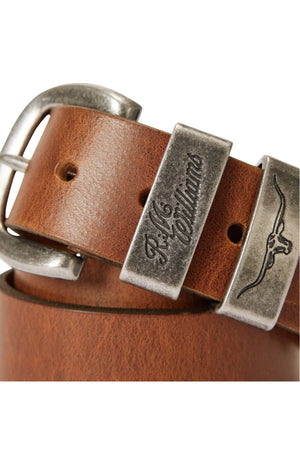 Close-up of the RM Williams Drover Belt, crafted in brown premium leather with an antique silver buckle and two engraved metal loops—one with "R.M. Williams" script, the other featuring a longhorn logo.