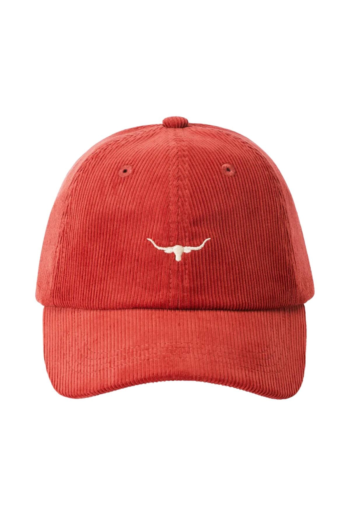 The RM Williams Mini Longhorn Cord Cap is a red organic cotton corduroy baseball cap with a small white embroidered Longhorn logo on the front and an adjustable strap.