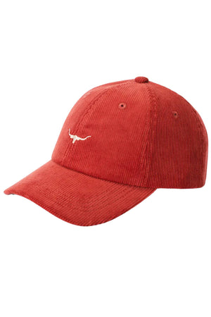 The RM Williams Mini Longhorn Cord Cap is a red organic cotton corduroy baseball cap with a curved brim, adjustable strap, and a small white Longhorn logo embroidered on the front.