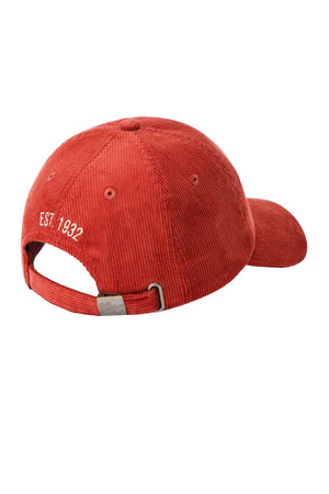 The RM Williams Mini Longhorn Cord Cap is a red organic cotton corduroy baseball cap, viewed from the back, with "EST. 1932" embroidered in white, an adjustable metal-buckle strap, and finished with the classic Longhorn logo.