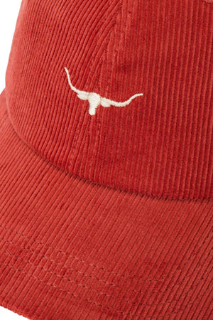 Close-up of the RM Williams Mini Longhorn Cord Cap in red organic cotton corduroy, featuring a white embroidered Longhorn logo on the front and an adjustable strap for comfort.