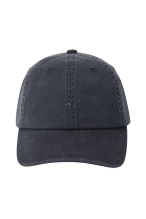 The RM Williams Mini Longhorn Twill Cap is a black, organic cotton baseball cap with visible stitching, a smile-like curved line on the front, an adjustable strap, and a slightly worn, faded look.