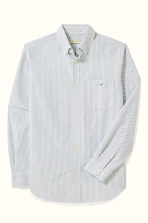 The RM Williams Regular Oxford Stripe Shirt in light blue and white pinstripes is made from organic cotton, featuring a button-down collar, chest pocket, and buttoned cuffs, displayed on a light background.