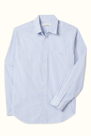 The RM Williams Regular Poplin Stripe Shirt features light blue and white stripes, organic cotton, a regular fit, long sleeves, front pocket, and subtle Longhorn embroidery, shown laid flat on a light background.