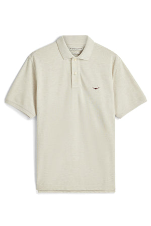 The RM Williams Rod Polo is a beige, short-sleeve classic polo shirt featuring a collar, three-button placket, and a small embroidered red logo on the left chest. Crafted from premium Australian cotton, it is displayed laid flat on a white background.