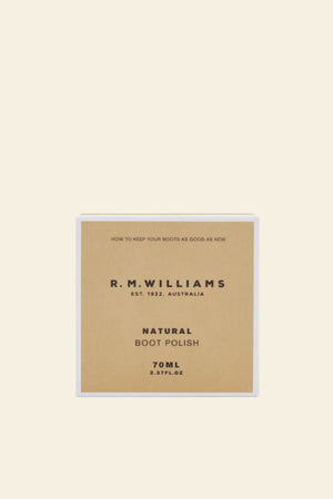 A 70ml square box of RM Williams Stockmans Boot Polish, featuring minimal tan and white packaging with bold black text, sits against a plain light background—a premium care essential for leather goods.