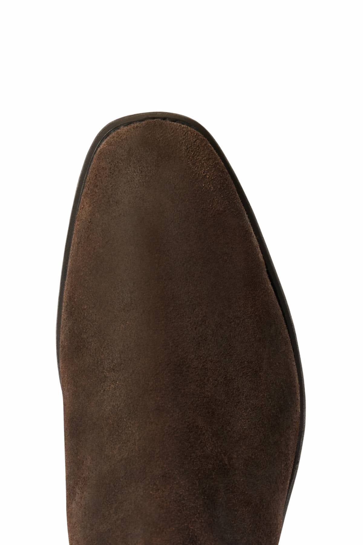 Close-up top view of the toe area of the RM Williams Comfort Craftsman Boot in brown waxed suede, featuring a slightly pointed, rounded shape against a white background.