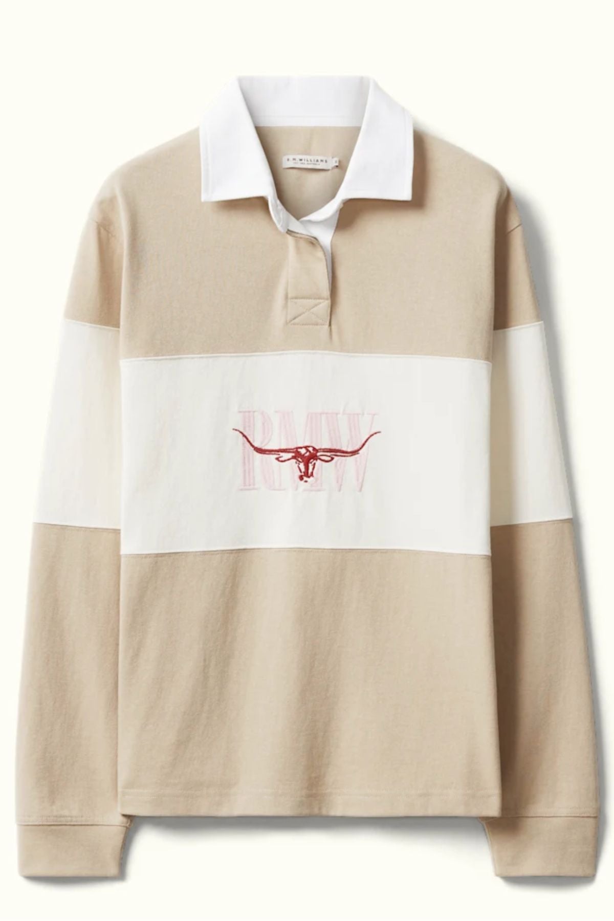 The RM Williams Narran Panel Rugby is an organic cotton rugby shirt in beige and white with a white collar, pink outlined longhorn steer horns, "PMW" lettering on the chest, and classic heritage logo embroidery.