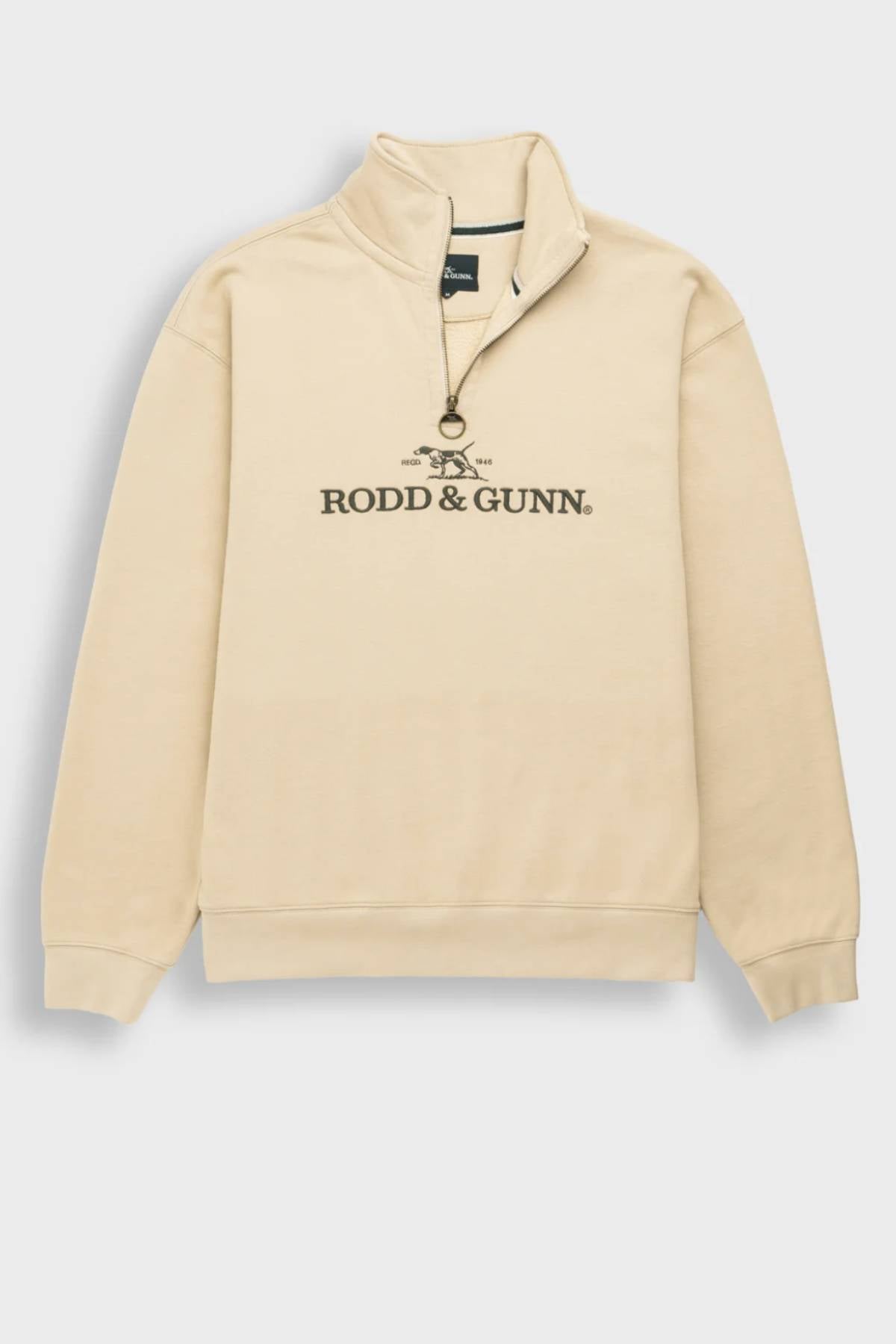 The Rodd & Gunn Milford Sound Sweat is a beige quarter-zip sweatshirt with a high collar, premium YKK metal zip and round pull tab, ribbed cuffs and hem, and a black "Rodd & Gunn" logo on the chest.