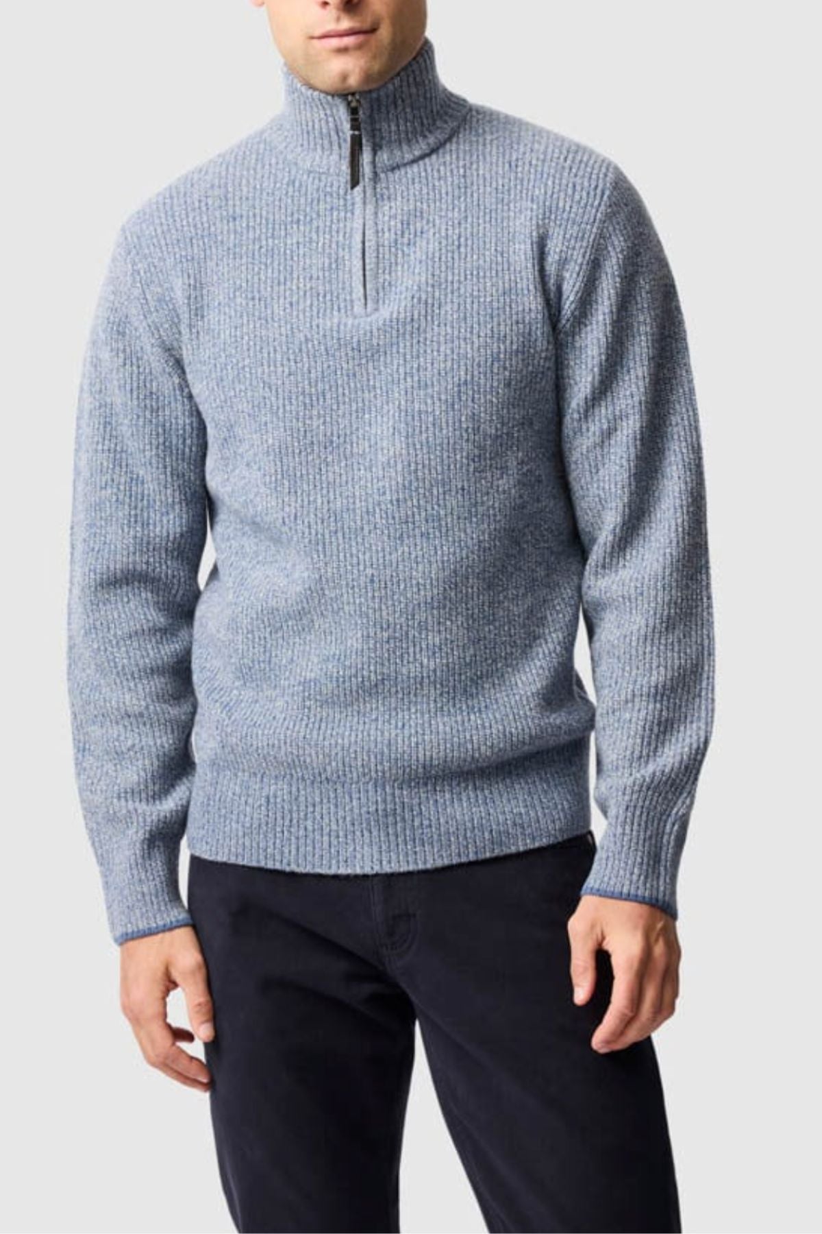 A man wears the Rodd & Gunn Robbies Road Knit pullover sweater with a half-zip collar and black pants, standing against a plain light gray background.