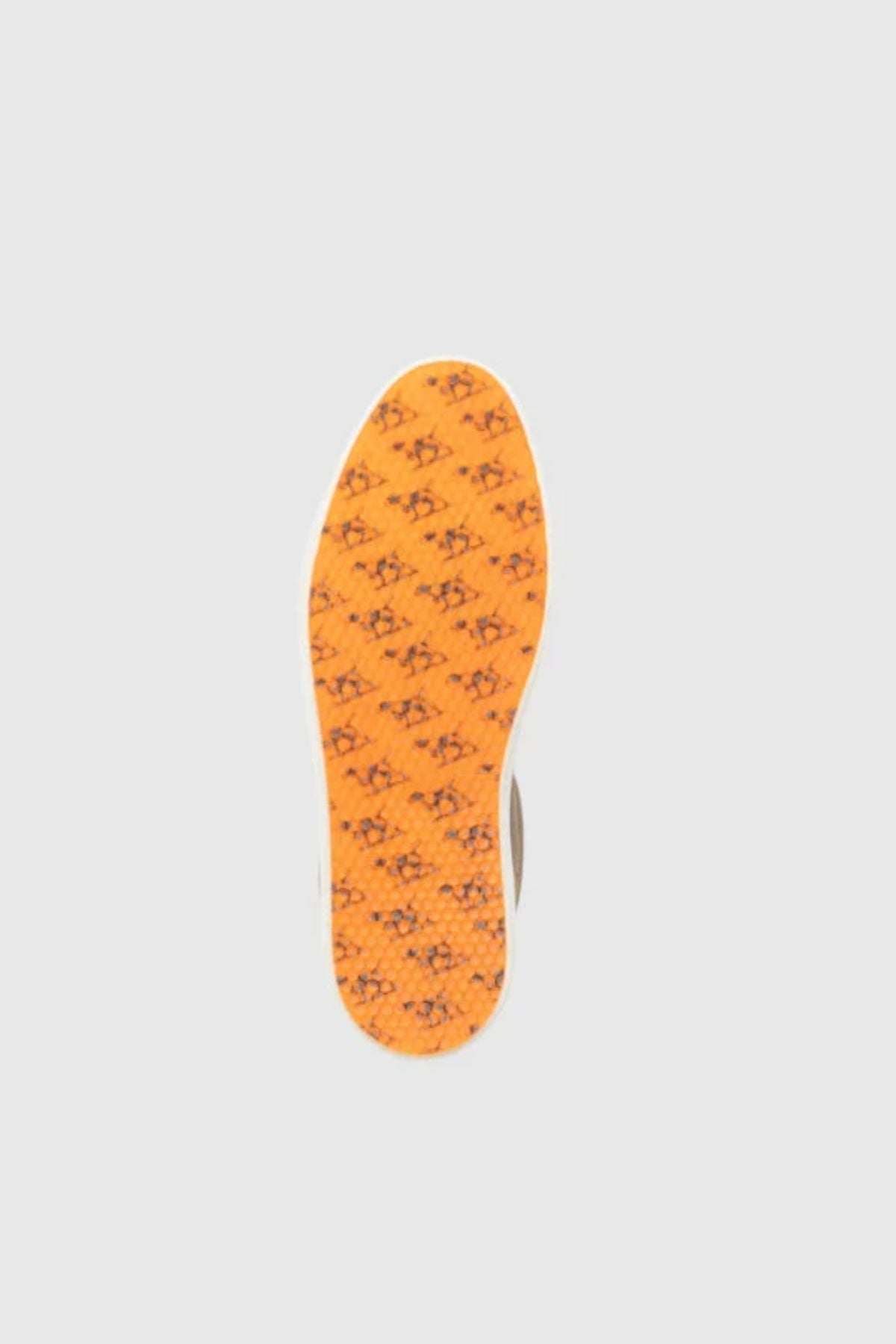 The Rodd & Gunn Transit Sneaker features an orange translucent outsole with a repeated black English Pointer pattern, shown from below against a light gray background.