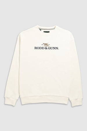 The Rodd & Gunn Bromley Sweat is a cream crewneck with a front logo and embroidered dog, made from recycled polyester, shown on a plain gray background.