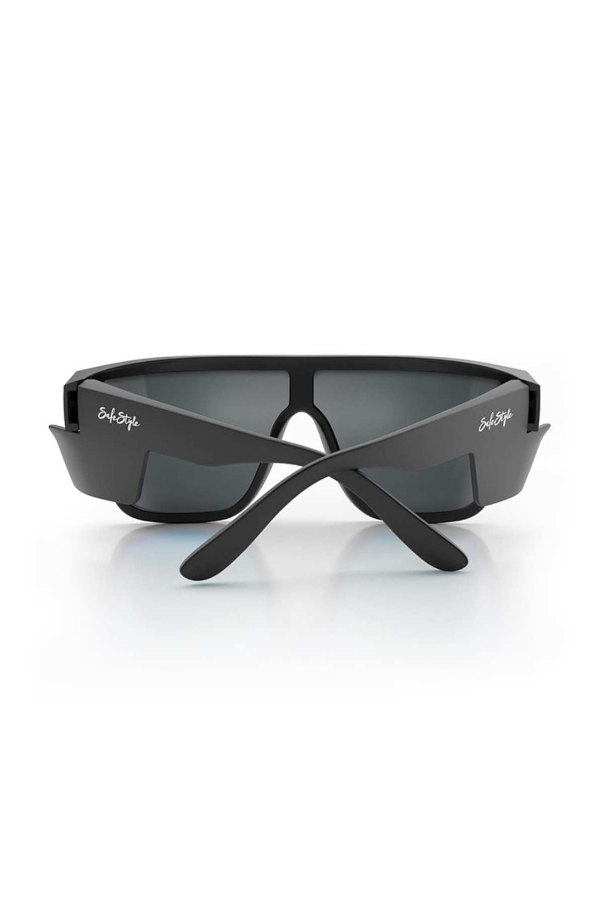 A pair of stylish black sunglasses with rectangular blue lenses, featuring wide arms and the brand name "SafeStyle" printed in white on the arms. Made from recyclable polycarbonate with matte black frames, these SafeStyle Primes Matte Black Frame Reflectors also offer UV protection. They are shown from the back, resting on a white surface.