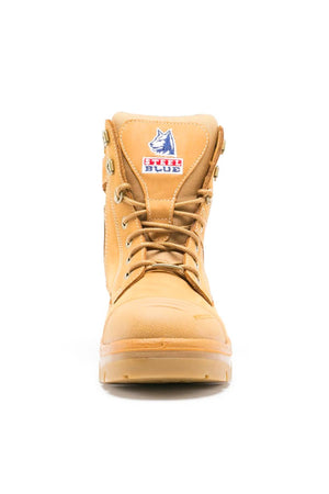 Front view of the Steel Blue Southern Cross Zip Boot in tan with metal eyelets, water-resistant leather, and a wolf logo patch with red text on the tongue, displayed against a white background.