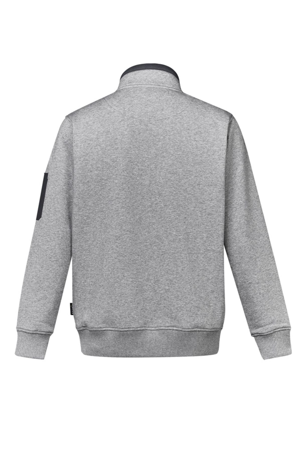 The Syzmik Half Zip Pullover is a plain light gray polyester/cotton sweatshirt shown from the back, with ribbed cuffs and hem, a contrasting dark collar, and a small black patch on the upper sleeve.