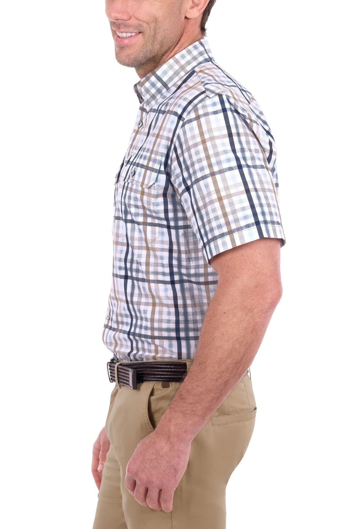 A man in the Thomas Cook Alfie Short Sleeve Shirt and khaki pants stands in profile, smiling, against a white background.