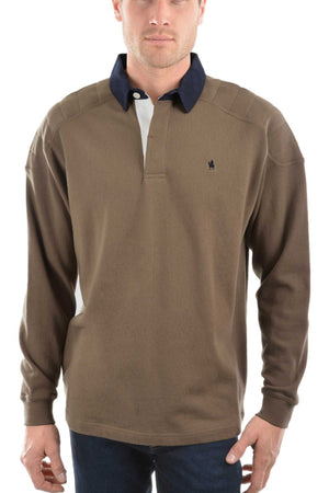 A man models the Thomas Cook Bill Rugby—a brown long-sleeve cotton jersey shirt with a dark blue collar, button placket, and small embroidered logo on the left chest—standing against a white background.
