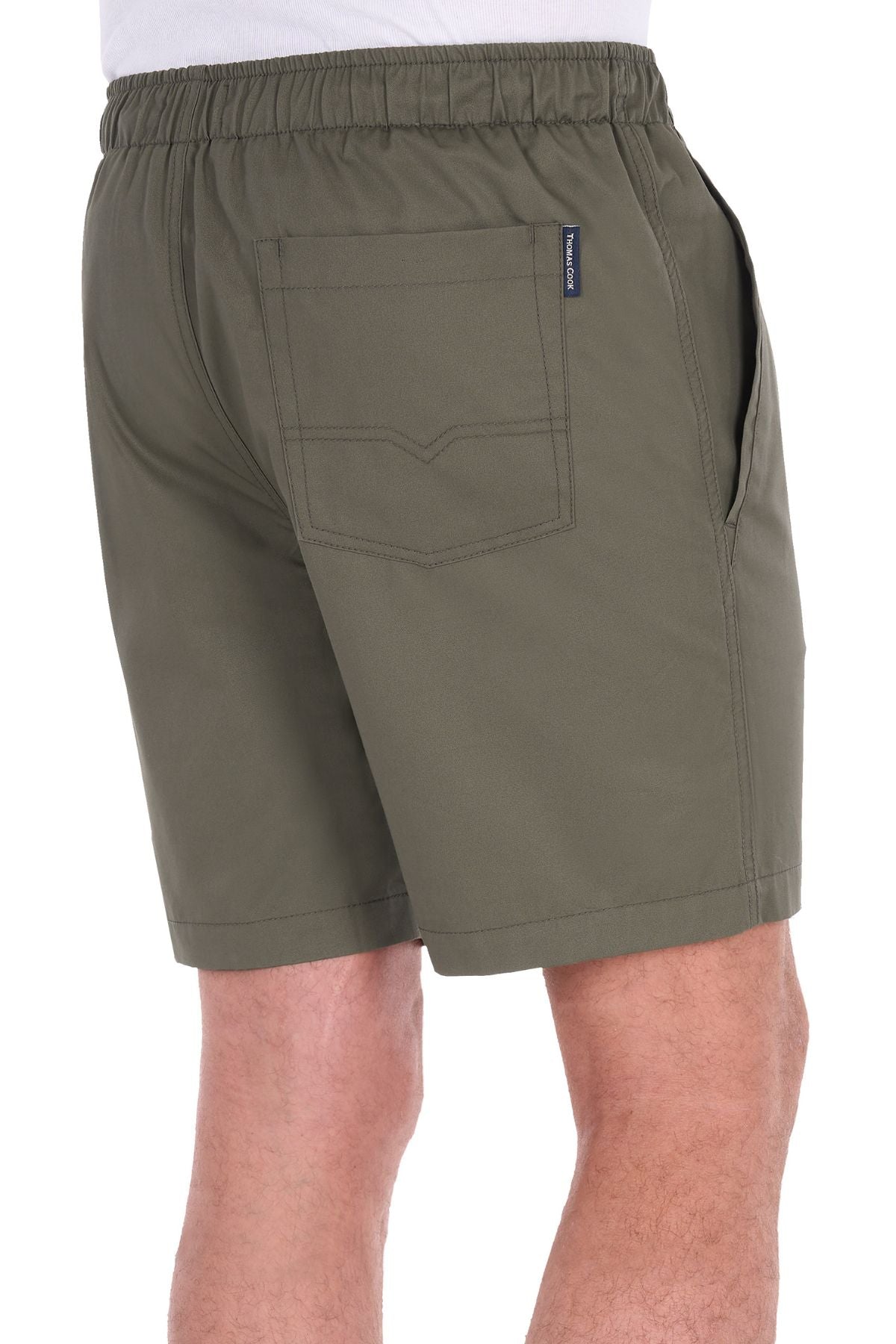 A person shown from the back is wearing olive green Thomas Cook Darcy Shorts, crafted from 100% cotton and featuring an elasticated waist, side pockets, and a back pocket.