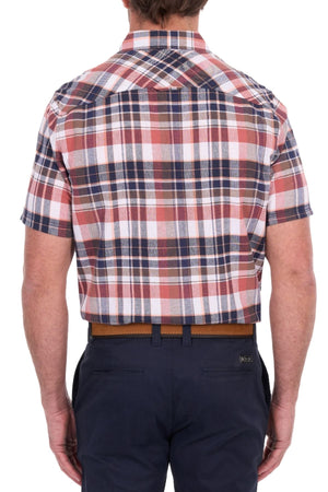 A person wearing the Thomas Cook Ethan Short Sleeve Shirt in a red, white, and blue plaid cotton linen fabric with navy pants, seen from the back against a white background.