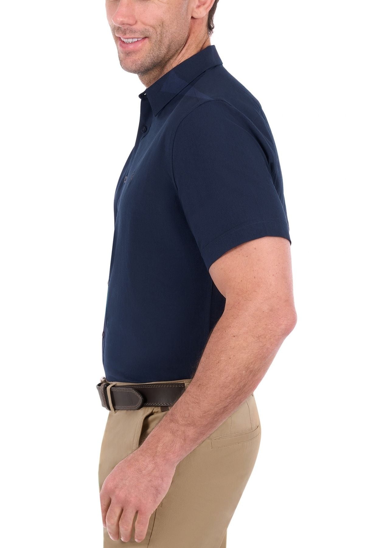 Man wearing a navy Thomas Cook Linen Short Sleeve Shirt, khaki pants, and a dark belt, shown from the side, facing left, against a white background.