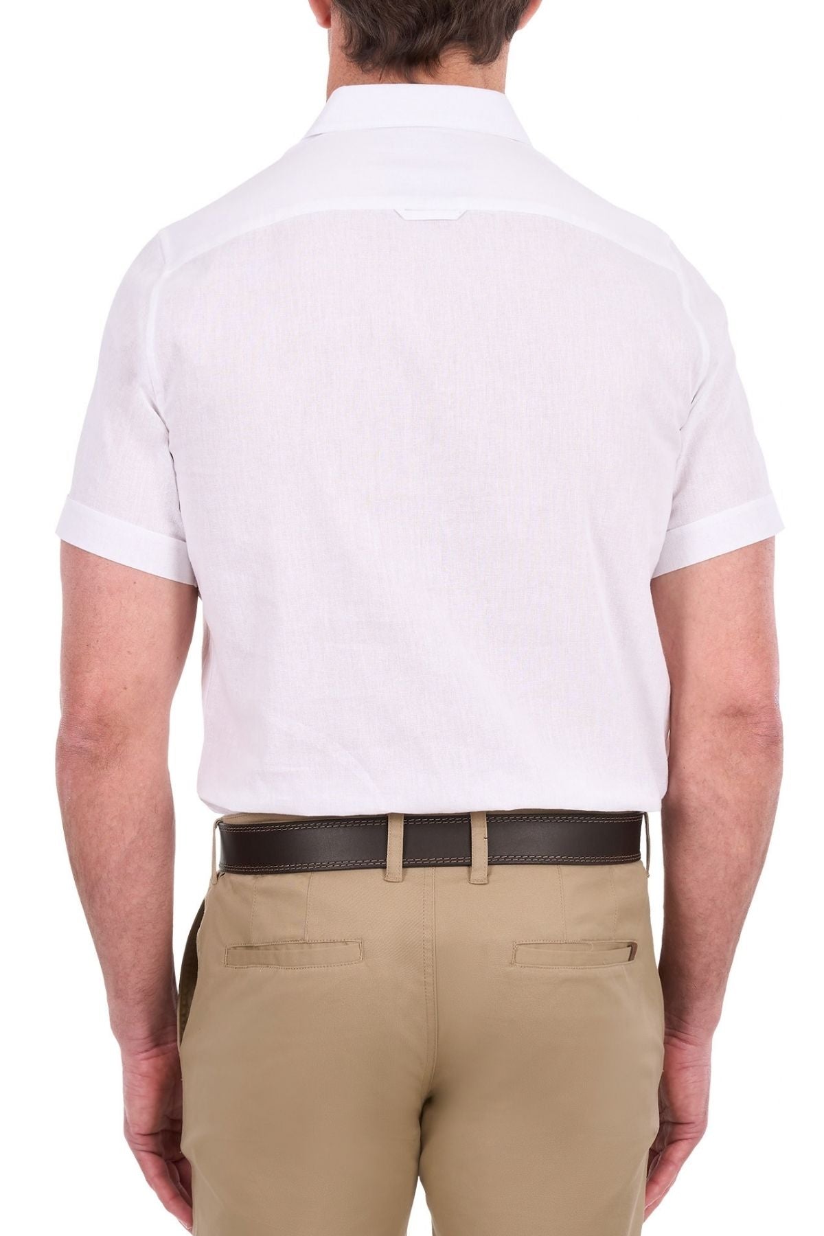 A man is shown from the back wearing the Thomas Cook Linen Short Sleeve Shirt in white and light brown pants with a dark belt, standing against a plain white background.