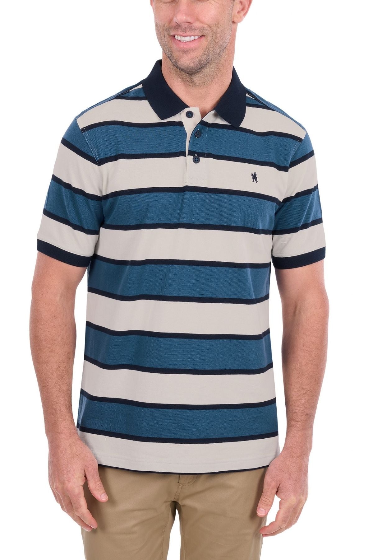 The man is wearing the Thomas Cook Martin Polo, a short-sleeve, collared men’s polo made from soft cotton pique with blue, navy, and beige horizontal stripes. He pairs it with khaki pants and smiles against a plain white background.